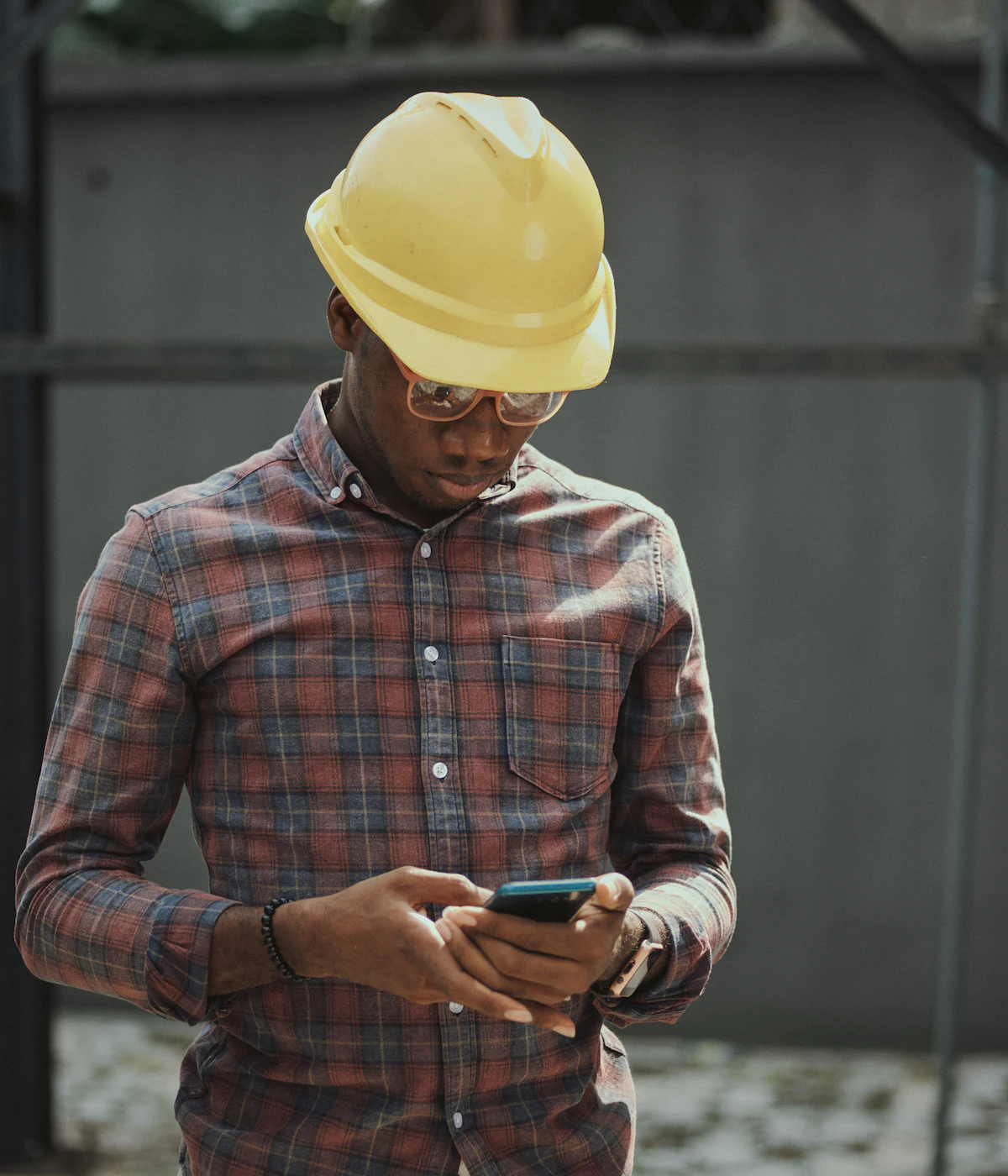 Contractor checking new leads on his phone
