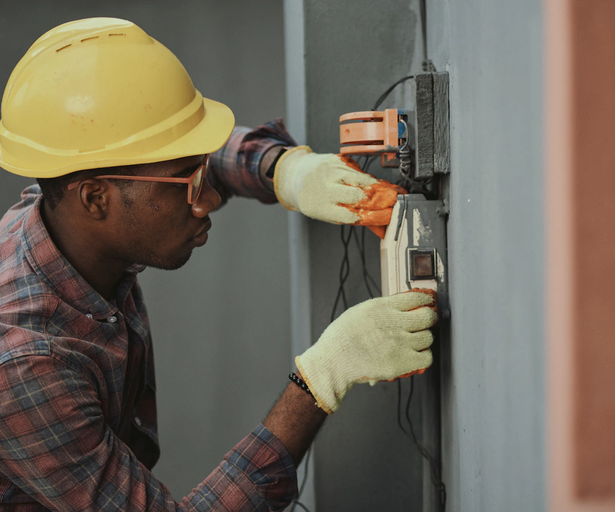 Electrician working on an electrical panel