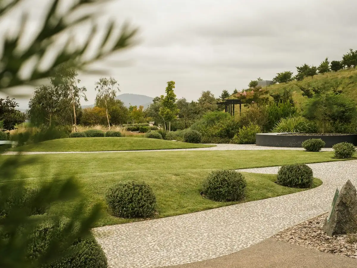 Gravel path winding through a landscaped lawn