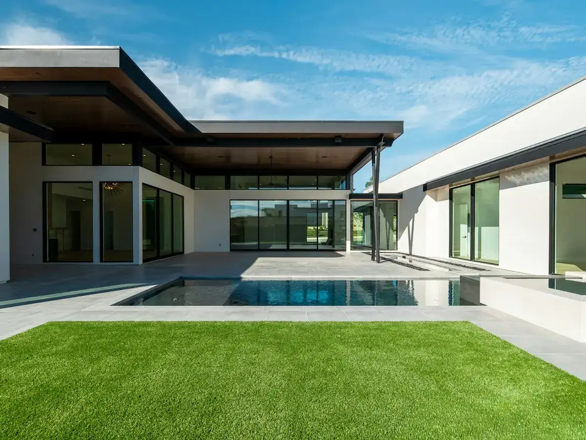 Bright lawn beside a modern pool