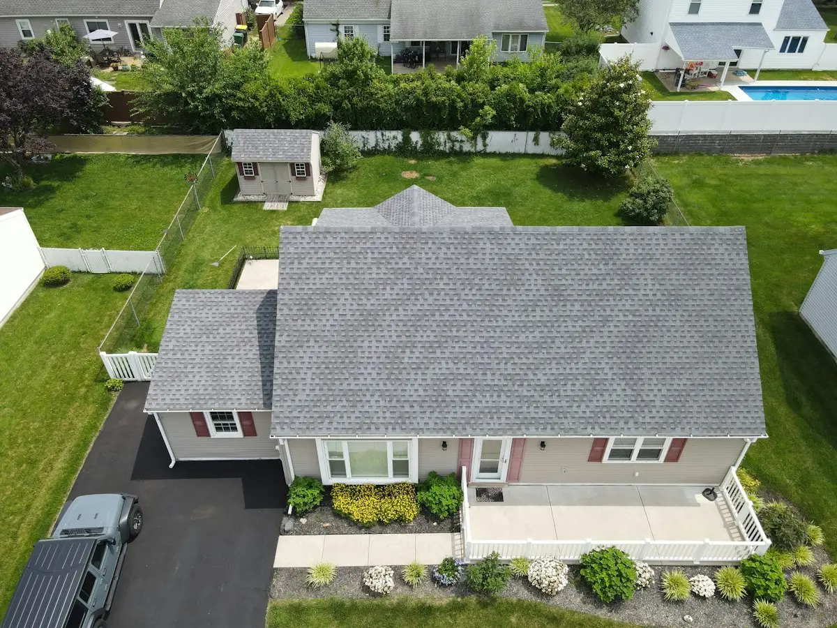 Aerial view of a home with a new grey roof